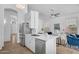Stylish kitchen featuring stainless steel appliances and a view of the comfortable living room at 7544 E Sierra Morena Cir, Mesa, AZ 85207