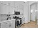 Updated kitchen with stainless steel appliances and white cabinets for a modern look at 7544 E Sierra Morena Cir, Mesa, AZ 85207
