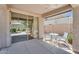 Covered patio with outdoor seating, providing a cozy space for relaxation and entertaining at 7544 E Sierra Morena Cir, Mesa, AZ 85207