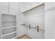 Spacious walk-in closet with rods and shelves for organized storage at 7544 E Sierra Morena Cir, Mesa, AZ 85207