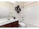 Bathroom with a single sink vanity, framed mirror, and a bathtub with shower at 7726 E Baseline Rd # 134, Mesa, AZ 85209
