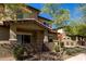 Beautiful two-story townhome exterior with a private patio and well-maintained landscaping at 7726 E Baseline Rd # 134, Mesa, AZ 85209