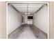 An empty two-car garage featuring laundry hookups, storage, and ample room for vehicles at 7726 E Baseline Rd # 134, Mesa, AZ 85209