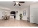 Spacious living room with tile flooring leading to a dining area and an open kitchen at 7726 E Baseline Rd # 134, Mesa, AZ 85209