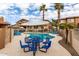 Community pool with plenty of lounge chairs and tables for relaxing and entertaining at 7726 E Baseline Rd # 134, Mesa, AZ 85209