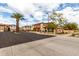 An exterior street view of residential home community with lush landscaping at 7726 E Baseline Rd # 134, Mesa, AZ 85209