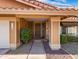Inviting front porch with a walkway and desert landscaping at 7726 W Cameron Dr, Peoria, AZ 85345