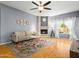 Bright living room with a cozy fireplace and lots of natural light at 7726 W Cameron Dr, Peoria, AZ 85345