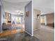 Open-concept living room with beautiful hard wood floors and a fireplace at 7726 W Cameron Dr, Peoria, AZ 85345