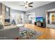 Bright living room featuring hard wood floors, a fireplace, and lots of natural light at 7726 W Cameron Dr, Peoria, AZ 85345