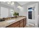 Bathroom with double sink vanity, granite countertop, and combination shower and tub at 913 W Juanita Ave, Gilbert, AZ 85233