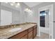 Bathroom boasts double sinks, granite countertops and tub with black and white tile at 913 W Juanita Ave, Gilbert, AZ 85233