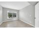 Well-lit bedroom with a window and neutral decor at 913 W Juanita Ave, Gilbert, AZ 85233