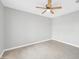 Bedroom with tile flooring, ceiling fan, and neutral-colored walls at 913 W Juanita Ave, Gilbert, AZ 85233