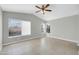 Spacious bedroom with vaulted ceilings, large windows, and a ceiling fan at 913 W Juanita Ave, Gilbert, AZ 85233