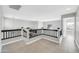 Open-concept hallway with neutral paint, tile flooring, and black banister at 913 W Juanita Ave, Gilbert, AZ 85233