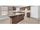Modern kitchen featuring granite countertops, tile floors, and ample cabinet space at 913 W Juanita Ave, Gilbert, AZ 85233