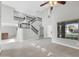 Bright, open living room features high ceilings, tile floors, and staircase to the upper level at 913 W Juanita Ave, Gilbert, AZ 85233