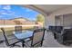 Back porch with comfortable seating and views of the backyard at 9626 W Bajada Rd, Peoria, AZ 85383