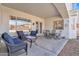 Back porch with comfortable seating and views of the backyard at 9626 W Bajada Rd, Peoria, AZ 85383