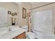 Bright bathroom featuring a single sink vanity, framed mirror and shower with curtain at 9626 W Bajada Rd, Peoria, AZ 85383