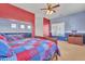 Colorful bedroom featuring a large closet with mirrored sliding doors and carpet flooring at 9626 W Bajada Rd, Peoria, AZ 85383