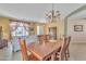 Formal dining room with chandelier and dining table with seating for eight at 9626 W Bajada Rd, Peoria, AZ 85383