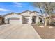 Charming single-story home featuring a stucco exterior, three-car garage and desert landscaping at 9626 W Bajada Rd, Peoria, AZ 85383