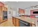 Kitchen island with granite countertop featuring a sink and seating at 9626 W Bajada Rd, Peoria, AZ 85383