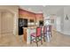 Bright kitchen features an island with seating and modern appliances at 9626 W Bajada Rd, Peoria, AZ 85383