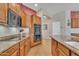 Bright kitchen featuring stone countertops and stainless steel oven at 9626 W Bajada Rd, Peoria, AZ 85383