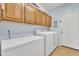 Functional laundry room equipped with a washer, dryer, and ample storage at 9626 W Bajada Rd, Peoria, AZ 85383