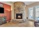 Cozy living room with a stone fireplace, offering a warm and inviting space at 9626 W Bajada Rd, Peoria, AZ 85383