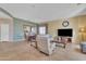 Open-concept living room with tile flooring, modern decor, and lots of natural light at 9626 W Bajada Rd, Peoria, AZ 85383