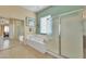 Spacious bathroom featuring a soaking tub and glass-enclosed shower at 9626 W Bajada Rd, Peoria, AZ 85383