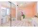 Well-lit bathroom with tile flooring, double sinks, and a glass-enclosed shower, providing a spa-like experience at 11816 S Winnebago St, Phoenix, AZ 85044