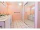 Spacious bathroom equipped with double sinks, large mirrors, and tile flooring, offering a clean aesthetic at 11816 S Winnebago St, Phoenix, AZ 85044