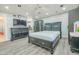This bedroom features a ceiling fan, hard floors, and matching furniture for a cohesive look at 11816 S Winnebago St, Phoenix, AZ 85044
