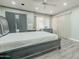 This bedroom features a ceiling fan, hard floors, and blackout blinds, providing comfort and privacy at 11816 S Winnebago St, Phoenix, AZ 85044