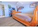 Comfortable bedroom with unique wood bed frame, wood flooring, and ample space for personalized touches at 11816 S Winnebago St, Phoenix, AZ 85044