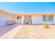 Welcoming front entrance with tiled pathway and decorative plants enhancing curb appeal at 11816 S Winnebago St, Phoenix, AZ 85044