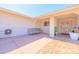 Comfortable front porch with seating, tiled floor, and view of the decorative front door at 11816 S Winnebago St, Phoenix, AZ 85044
