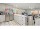 Spacious kitchen boasts stainless steel refrigerator and breakfast bar, ideal for casual dining at 11816 S Winnebago St, Phoenix, AZ 85044