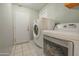 Functional laundry room equipped with modern appliances, ensuring efficient and convenient laundry care at 11816 S Winnebago St, Phoenix, AZ 85044