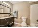 Traditional bathroom featuring a dark wood vanity and shower-tub combo at 1257 W Dublin St, Chandler, AZ 85224