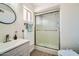 Bathroom features a modern sink, grey vanity, and a glass enclosed shower stall at 1257 W Dublin St, Chandler, AZ 85224