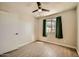 Light filled bedroom offering modern vinyl floors, ceiling fan, and closet space at 1257 W Dublin St, Chandler, AZ 85224