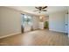 Bedroom featuring wood-look floors, ceiling fan, and ensuite bathroom access at 1257 W Dublin St, Chandler, AZ 85224