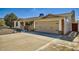 Charming home exterior featuring a well-maintained front yard and two-car garage at 1257 W Dublin St, Chandler, AZ 85224