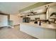 Open kitchen with white cabinets, an island, and stainless steel appliances at 1257 W Dublin St, Chandler, AZ 85224